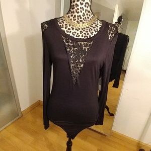 Brand new leotard with black lace .